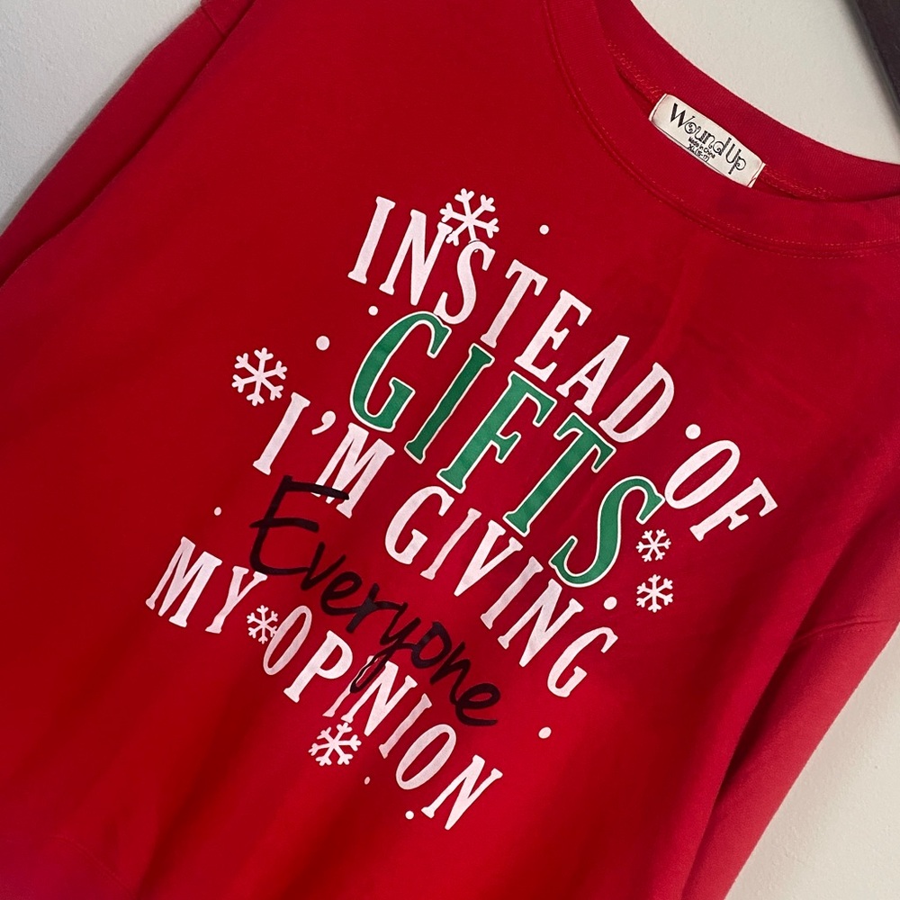 Wound Up Juniors Red Holiday Sweatshirt w/ Bold Text “Instead of Gifts, Opinion”